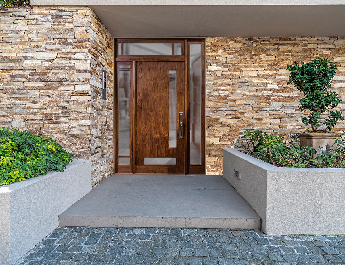 Walnut modern front door with glass