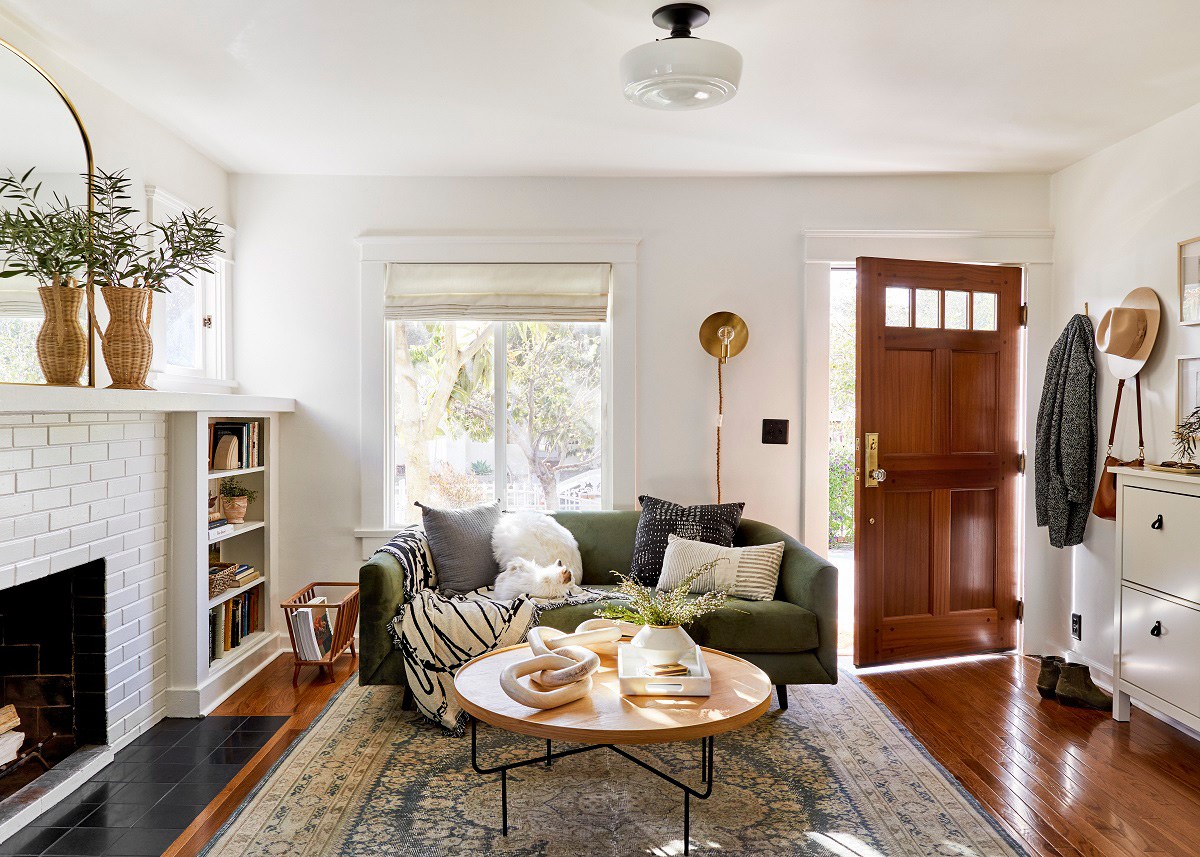 Front door opened to a living room with a contemporary modern style.