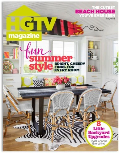 Front cover of a summer edition of HGTV magazine with bright colors and a living room table front and center.