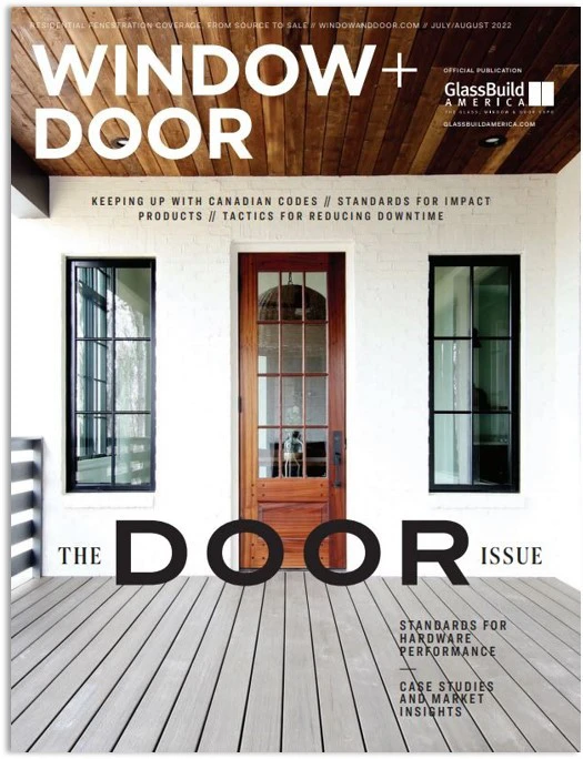 Simpson's Nantucket Collection door in mahogany contrasting the white exterior of the house on the cover of Window + Door magazine.